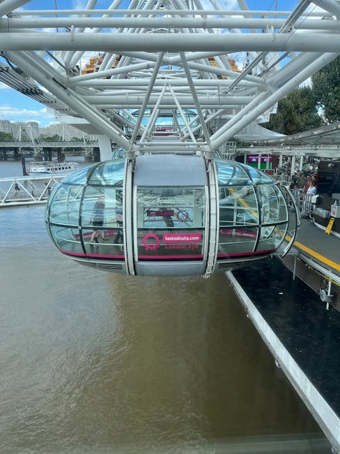 A daytime view of the Westminster Bridge spanning the River Thames in London, featuring ornate lampposts along the balustrade and a series of arches beneath the bridge. The bridge's painted details are visible, and the surface appears clean and well-maintained. In the background, the historic gothic-style church tower and other iconic London landmarks can be seen under a partly cloudy sky, with sunlight illuminating the scene. The stairs leading down from the riverbank are visible in the foreground, constructed from stone with metal railings, suggesting recent cleaning or maintenance for safety and aesthetic purposes. The image highlights the architectural features and cleanliness of the public space, consistent with surface cleaning and preservation efforts that might be carried out by professional cleaning services like Carpet Cleaners Lambeth.